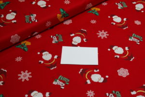 Baumwolle Webware Weihnachten Weihnachtsmänner auf rot