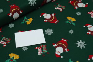 Baumwolle Webware Weihnachten Weihnachtsmänner auf grün
