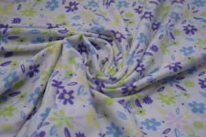Baumwolljersey bunte Blumen auf weiß