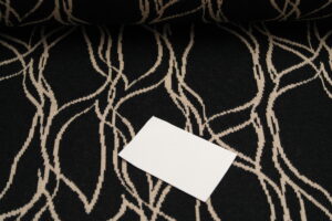 Jacquard Strick Brush Strokes sand auf schwarz